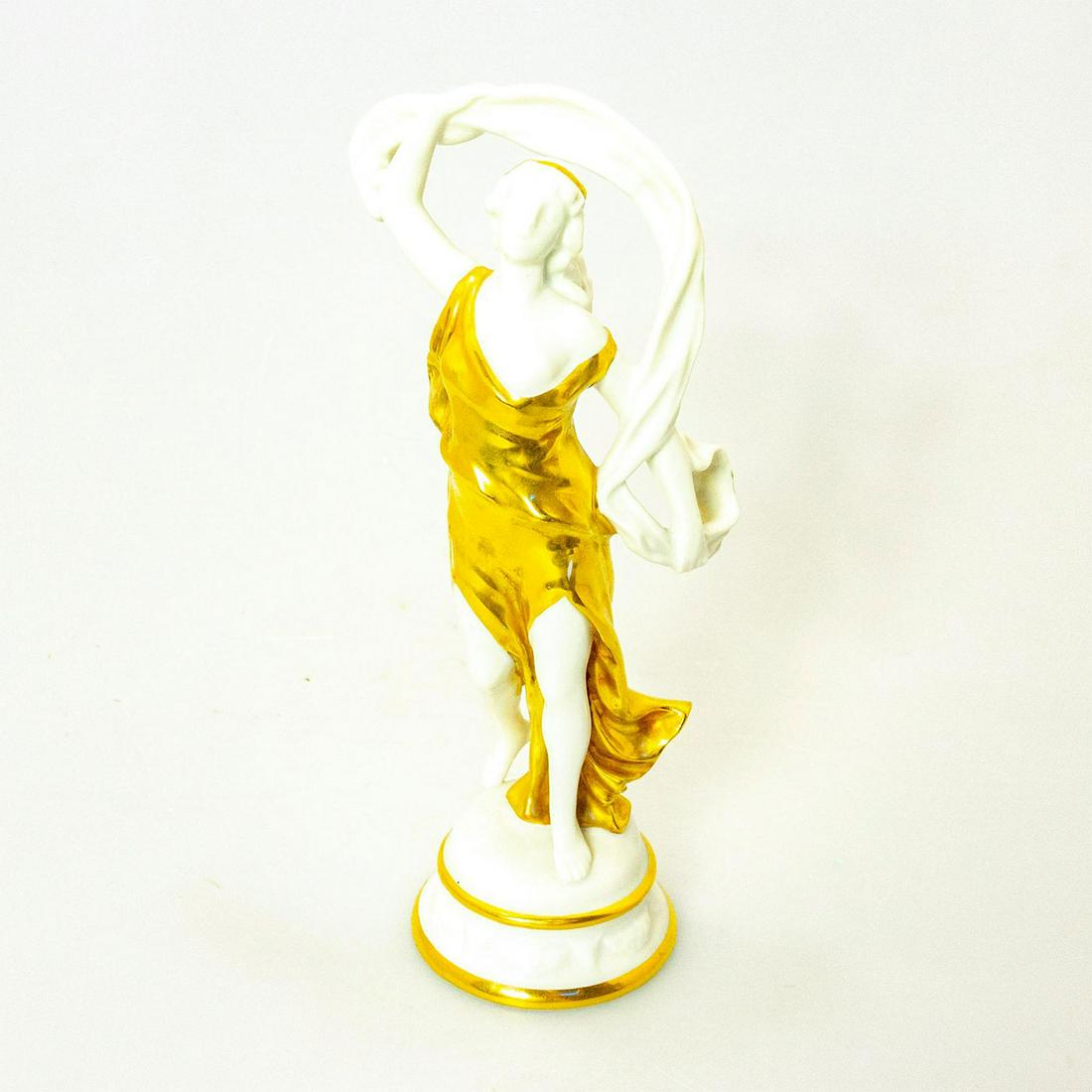 Capodimonte Italian Porcelain Figurine, Dancer: Woman enveloped in robes and dressed in gilded garments. Porcelain; high gloss finish. Capodimonte backstamp. Issued: 20th c. Dimensions: 8.5"H Manufacturer: Capodimonte Country of Origin: Italy