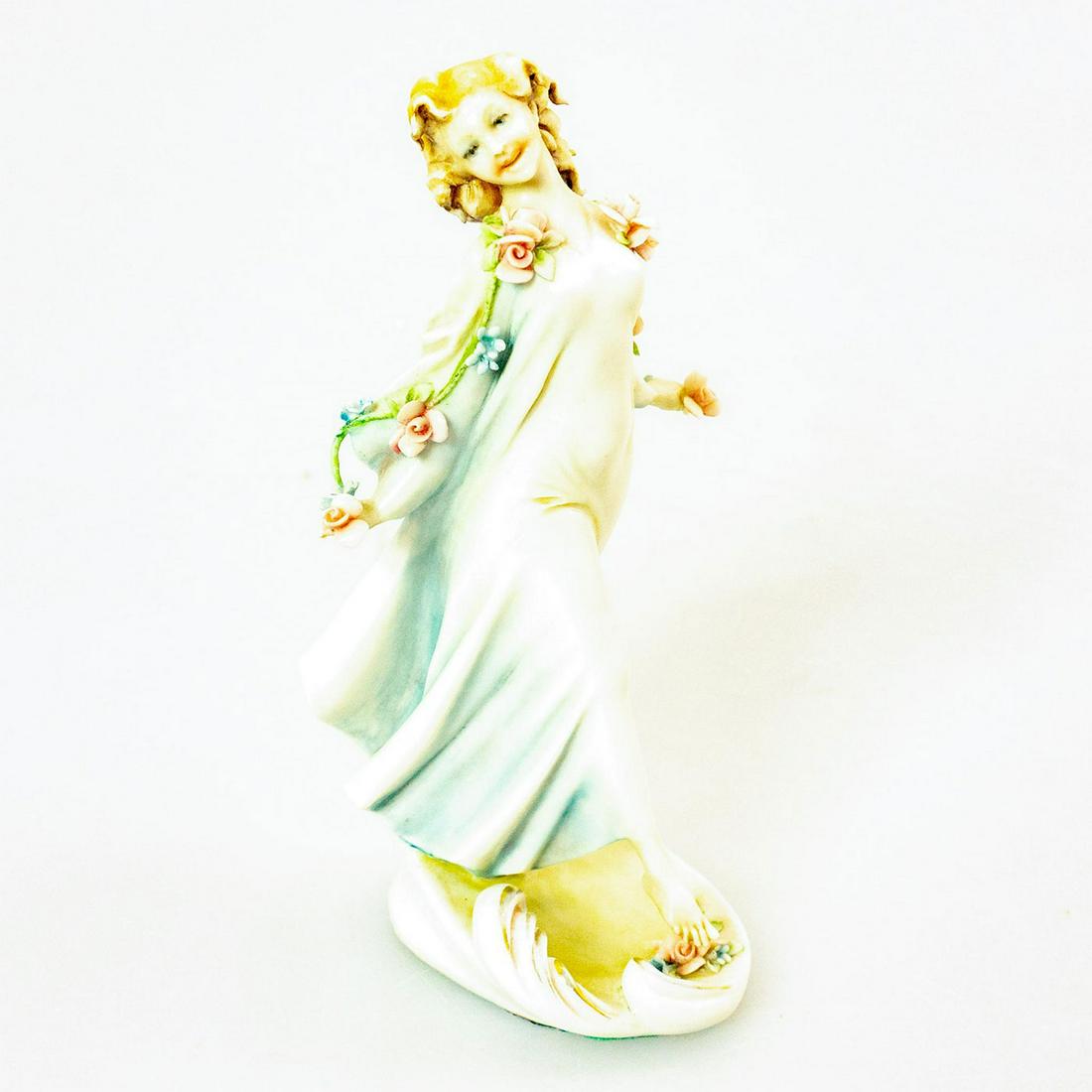 Antonio Borsato Italian Figurine, Spring Time: Stunning miniature figure of a young girl adorned with delicate flowers. Pink and blue coloration. Signed A Borsato. Marked, Made in Italy on the underside. Artist: Antonio Borsato Issued: 20th c. Dim