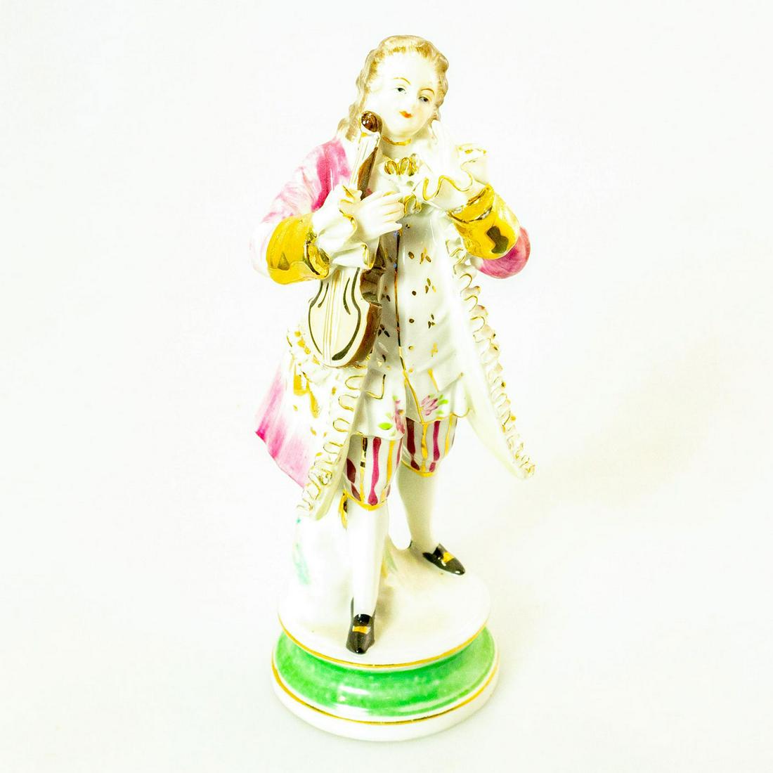 Vintage Bone China Lace Figurine, Musician: Pink and white coloration; extensive bone china lace detail; gilt accents. Bone China lace maker's mark on the underside. Issued: 20th c. Dimensions: 8.5"H Country of Origin: Japan