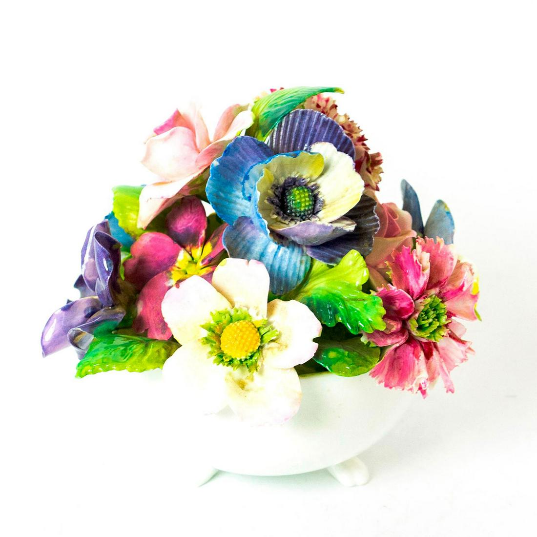 Crown Staffordshire Fine Bone China Flower Pot: Hand painted; polychrome figure of bone china floral display. Delicate flowers molded with great detail in footed pot. Crown Staffordshire backstamp. Chips to petals. Issued: 20th c. Dimensions: 5.25"
