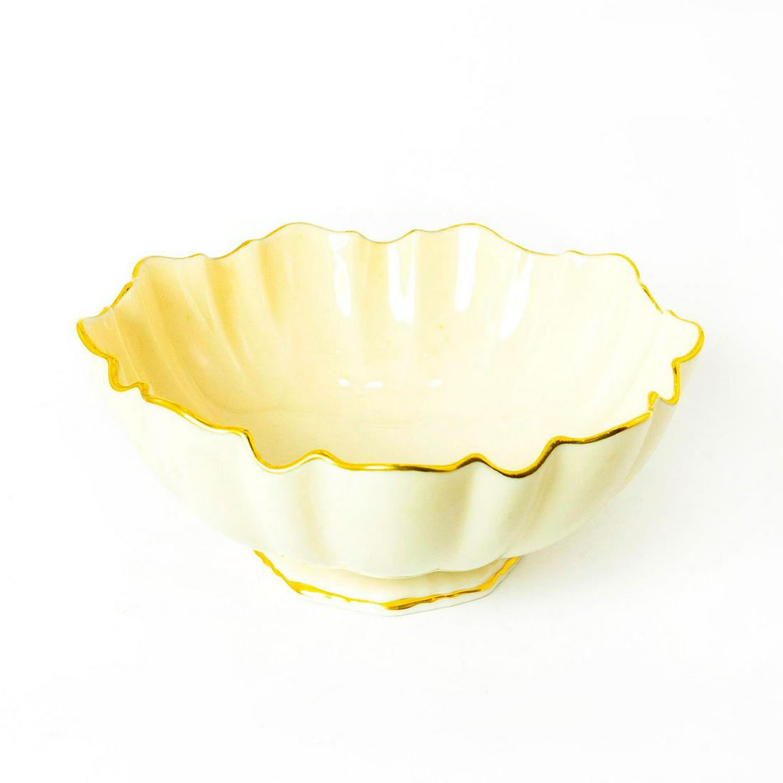 Vintage Lenox Ceramic Footed Bowl: Ivory colored bowl with scalloped gilt rim. Lenox backstamp. Issued: 20th c. Dimensions: 2.5"H x 6" dia. Manufacturer: Lenox Country of Origin: United States