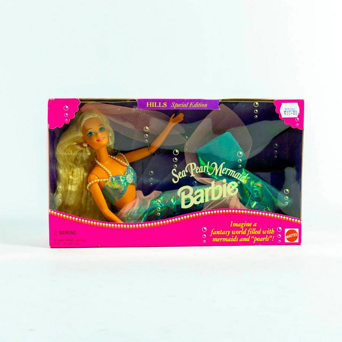 Barbie Doll, Sea Pearl Mermaid: She wears an iridescent mermaid skirt and tail and bikini top with pearl straps and earrings. SKU #13940. #barbie #mermaids Issued: 21st c. Dimensions: 12"H Manufacturer: Mattel Country of Origin: Ind