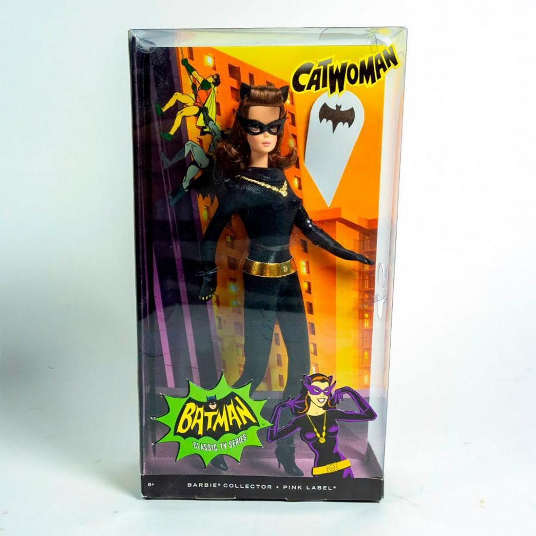 Mattel, Catwoman Barbie Doll: Barbie as Catwoman; all black, skintight outfit with gold accents. With original box. SKU #Y0304. #barbie #catwomanbarbie Issued: 2012 Dimensions: 13"H Manufacturer: Mattel Country of Origin: China