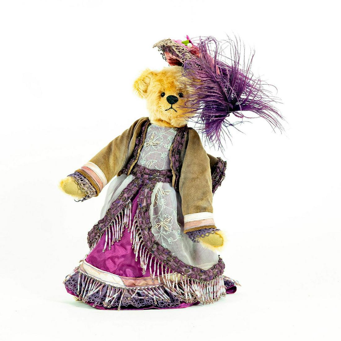 Martha's Bears Teddy Bear, Glorianna: Bear dressed in lavish purple outfit and hat; Lace and beads. With stand. Issued: 2004 Dimensions: 13"L Manufacturer: Marthas Bears Country of Origin: USA