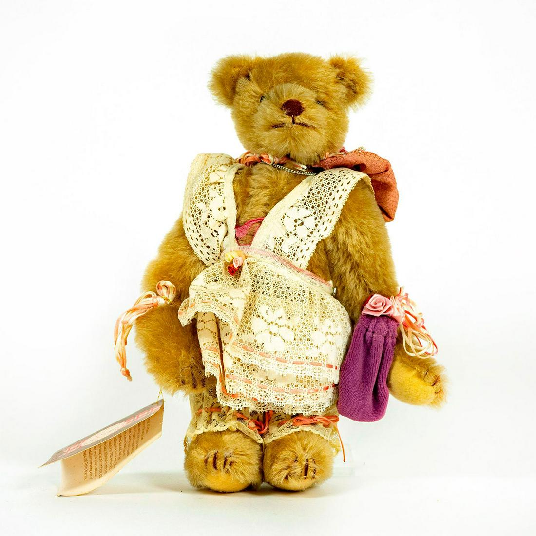 Time Machine Teddy Bear, Thank Heaven for Little Girls: European mohair teddy with she button eyes and hand embroidered face. Wearing lace dress and bonnet. Original label attached to left arm. Original tag on back with addition number. Working music box w