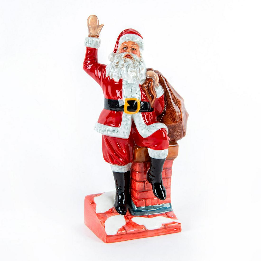 Santa Claus HN4175 - Royal Doulton Figurine: Santa standing by the chimney with sack of toys. Red, black and white coloration. Doulton backstamp. Issued: 2000 Dimensions: 9.5"H Manufacturer: Royal Doulton Country of Origin: England