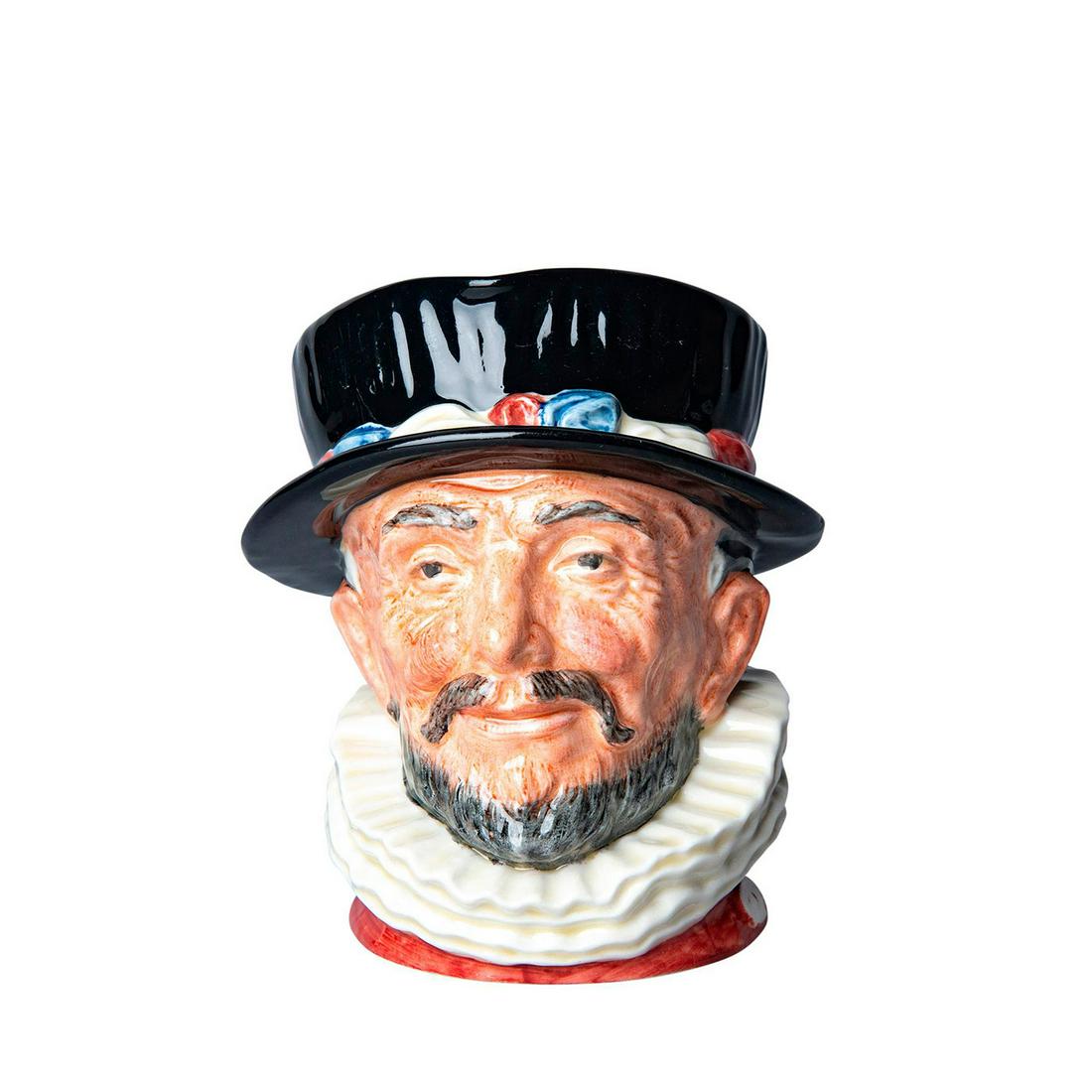 Beefeater D6202 ER - Large - Royal Doulton Character: Handcrafted Beefeater mug - black hat with red, white and blue rim. Plush collar, accenting a red shirt. Royal Doulton backstamp. Dimensions: 6"H Manufacturer: Royal Doulton Provenance: David Bearman 