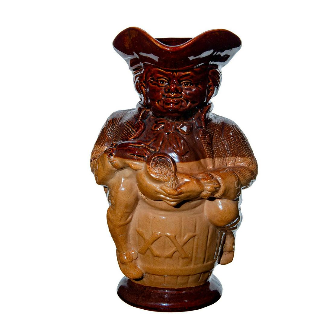 Doulton Lambeth Stoneware Large Toby XX Jug: Saltglaze. Hand holds jug of ale, with handle. Doulton Lambeth backstamp. Issued: c. 1891 Dimensions: 10"H Manufacturer: Doulton Lambeth Country of Origin: England