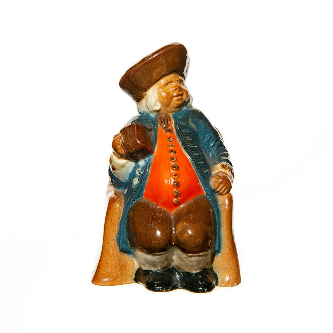 Royal Doulton Lambeth Armchair Toby Jug: Royal Doulton armchair Toby with a bright orange vest and dark teal coat. Doulton stamp. Dimensions: 4.5"H Manufacturer: Royal Doulton Country of Origin: England Provenance: David Bearman Collection