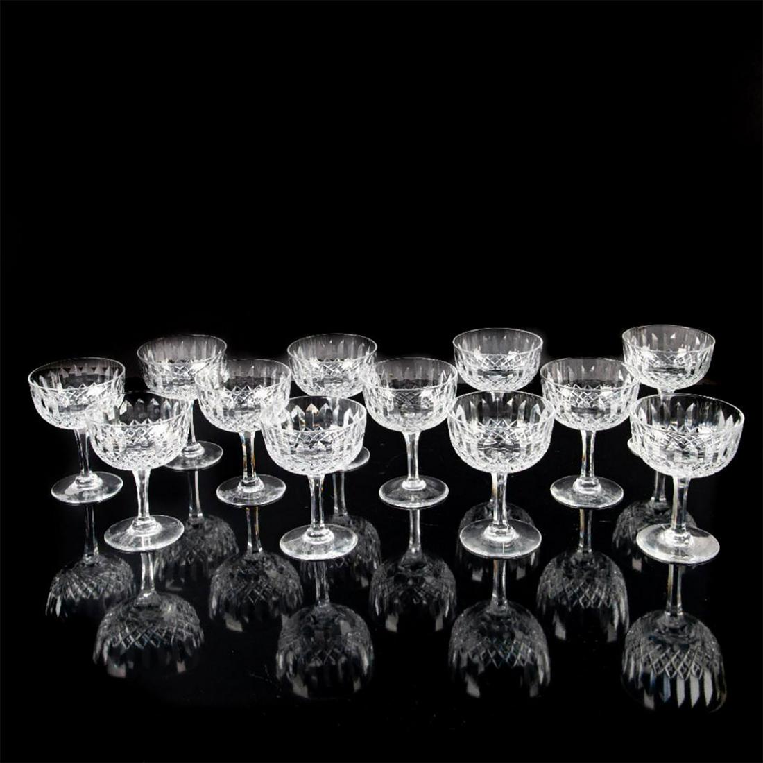12pc Waterford Normandy Crystal Champagne Glasses by: Elegant hand-crafted cut Waterford crystal in Normandy pattern. Thomas Webb backstamp. Thomas Webb began his glass career in 1829, when he became a partner of the Wordsley Glassworks. Soon after, he a
