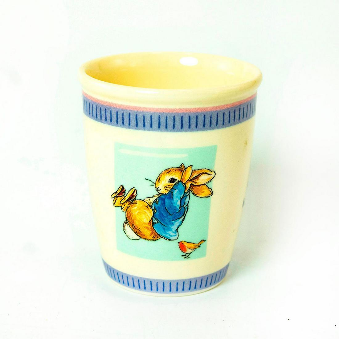 Wedgwood Beatrix Potter, Peter Rabbit Cup: Ceramic cup with Peter Rabbit illustrations on side. In original box. Issued: 2001 Dimensions: 3.5"H Manufacturer: Wedgewood Country of Origin: England