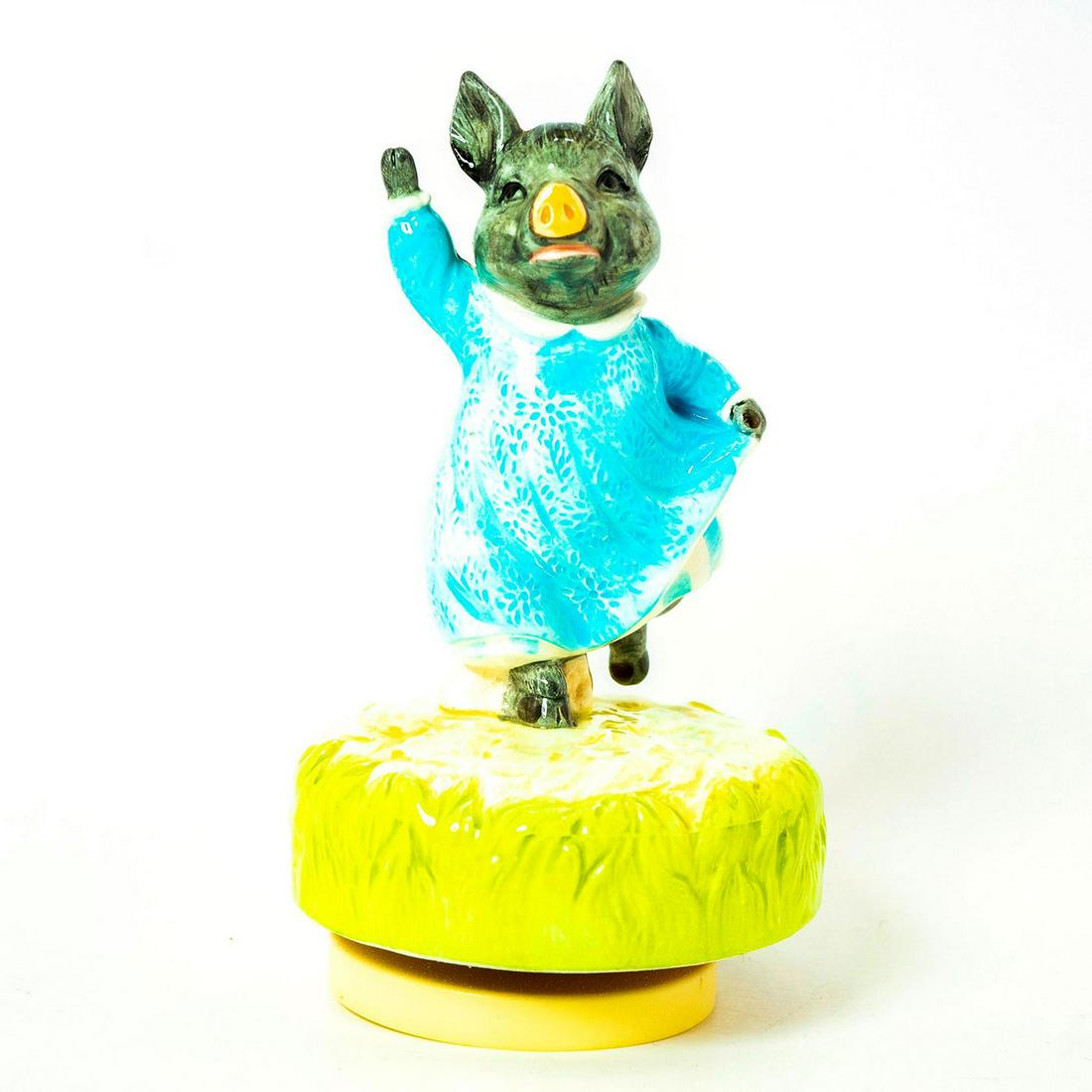 Schmid Music Box, Beatrix Potter, Pig - Wig: Pig in blue dress skipping across green rotating musical base. Schmid backstamp. Original manufacture's label. Inscription on side reading 'Pig - Wig, Beatrix Potter, Schmid'. Issued: 1983 Dimensions: