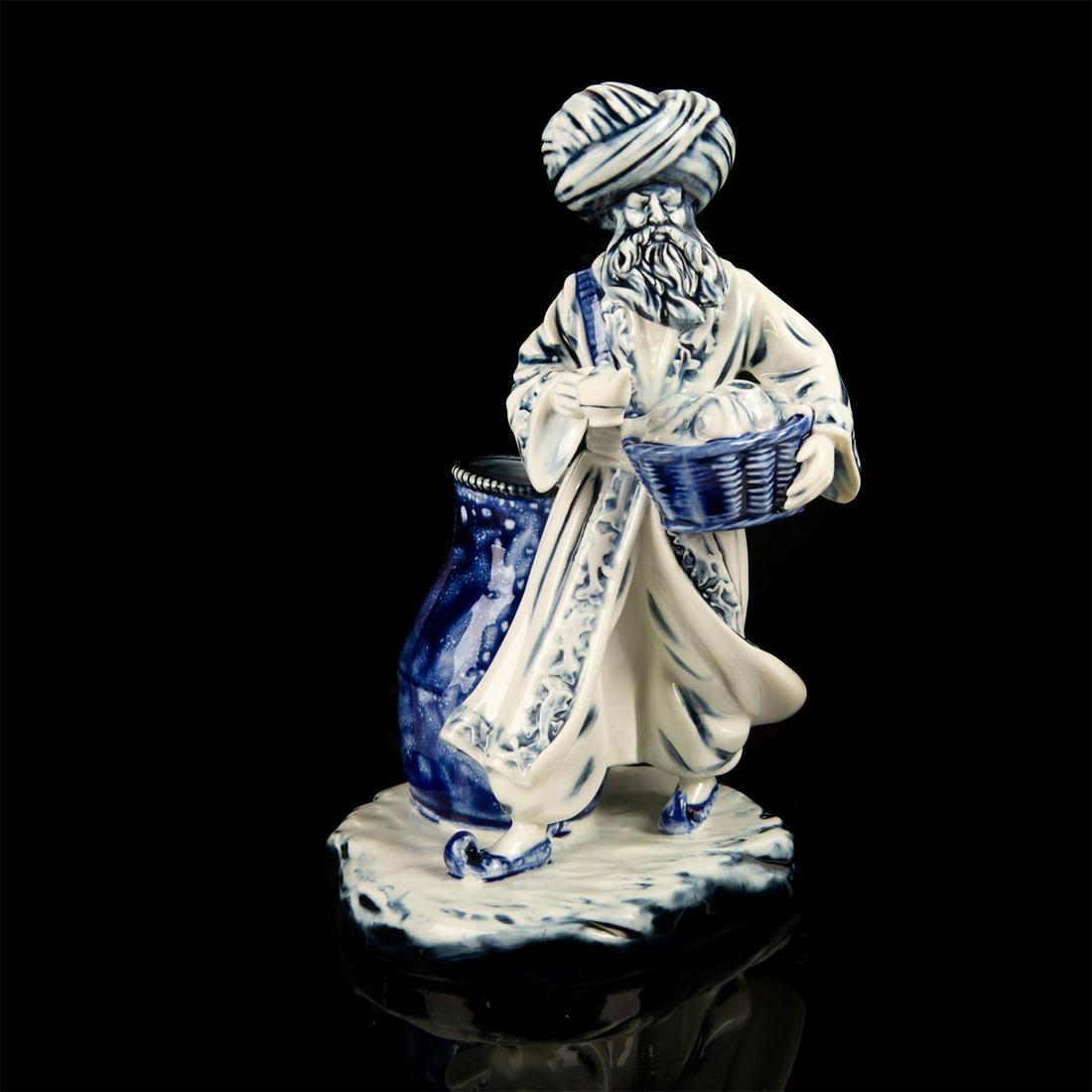 Royal Doulton Blue Flambe Lamp Seller HN3278: Designed by Robert Tabbenor. Artist: Robert Tabbenor Issued: 1990 - 1995 Dimensions: 9"H Manufacturer: Royal Doulton Country of Origin: England