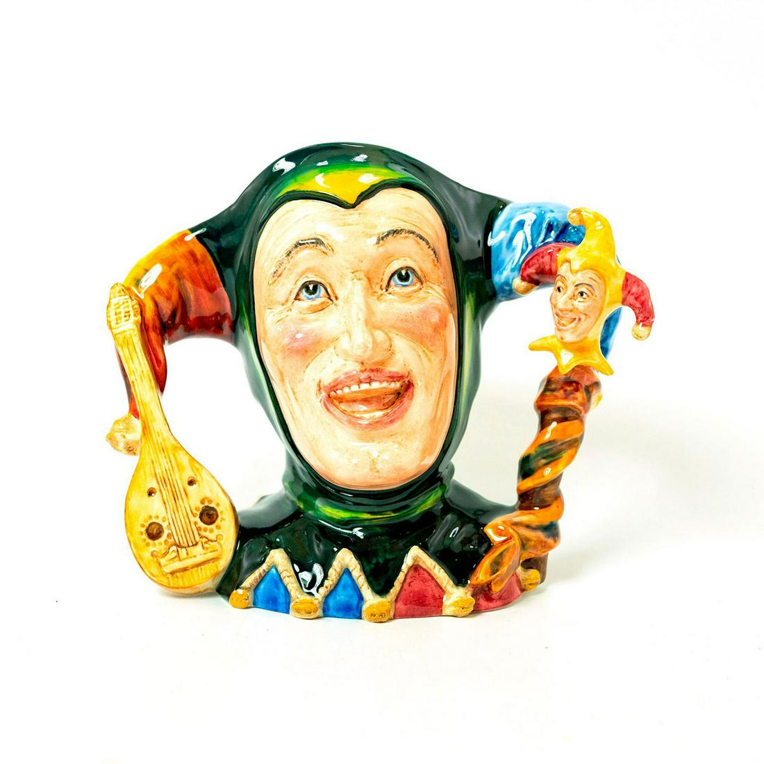 The Jester - Pascoe & Company Character Jug: Exquisite glossy porcelain modeled as The Jester complete with lute and puppet. Green cowl with blue red and orange details. Limited edition. Pascoe & Company backstamp with artist signatures. Issued: