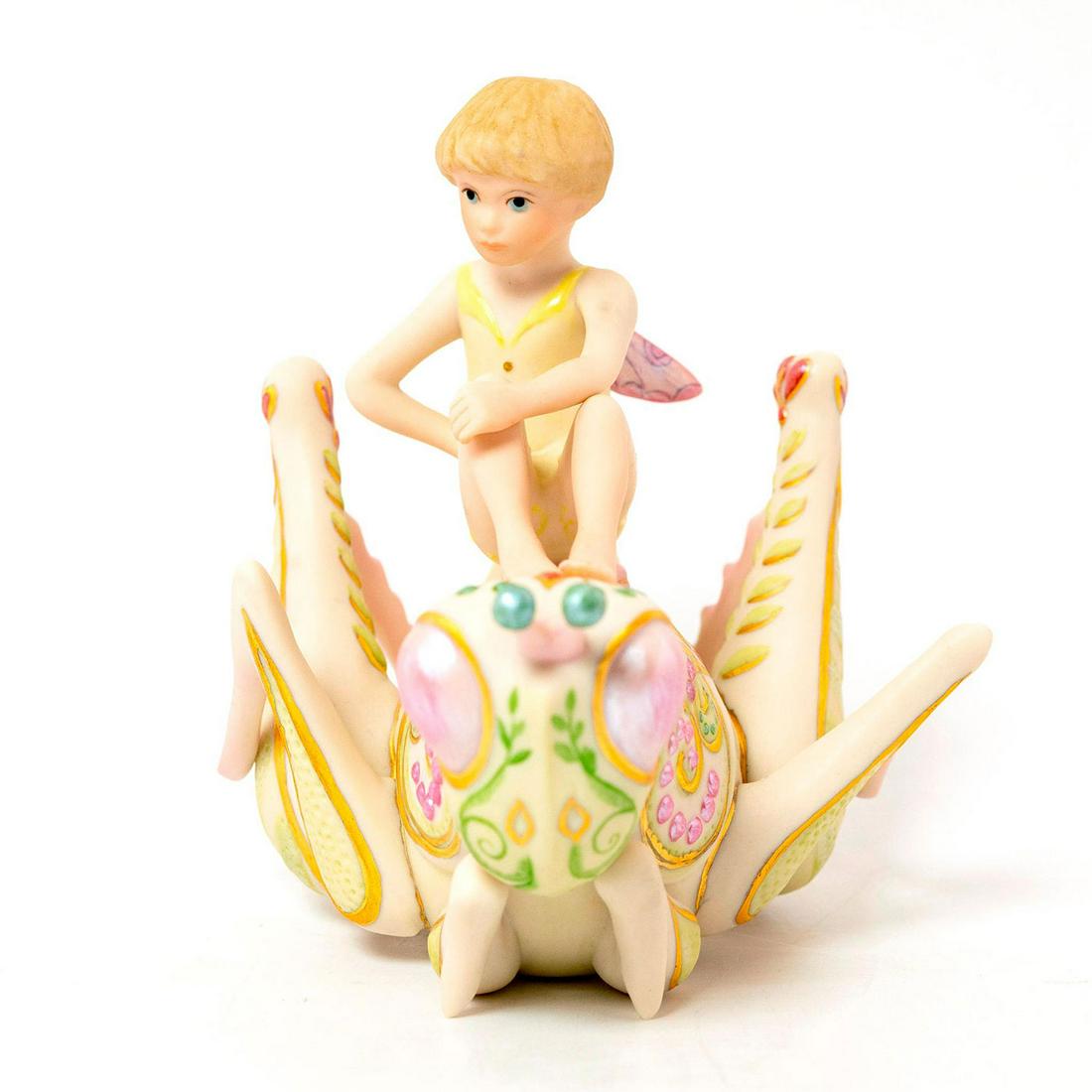 Cybis Porcelain Figurine, Ariel: Land of Chimeric Collection. Features a fairy atop a grasshopper. Porcelain; matte finish. Soft pastel coloration; gilt accents. Cybis backstamp. Issued: 1981 Dimensions: 5.25"H Manufacturer: Cybis Co