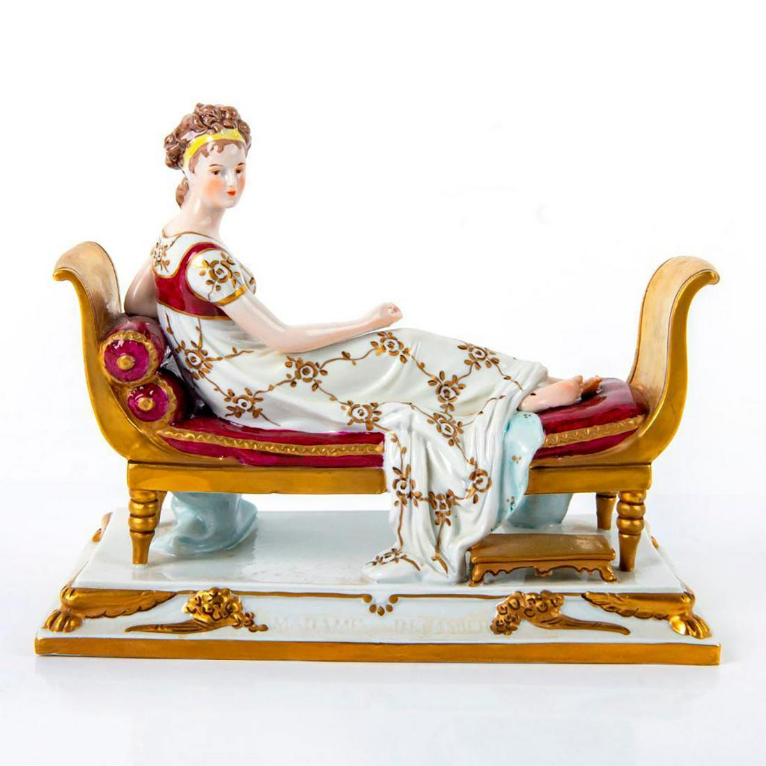 Scheibe Alsbach Figurine, Madame Recamier: Hand painted porcelain figure of Juliette Recamier after portrait painting by Jacques Louis David. Crimson and white coloration with gilt accents. Impressed Madame Recamier. Scheibe Alsbach backstamp.