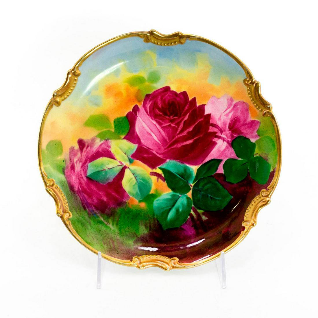 BM De M Limoges Plate, Pink Roses: Antique hand painted gold rimmed plate with pink roses. Signed A. Marty on the top. BM De M France backstamp. Issued: 20th c. Dimensions: 10"W Manufacturer: Limoges Country of Origin: France