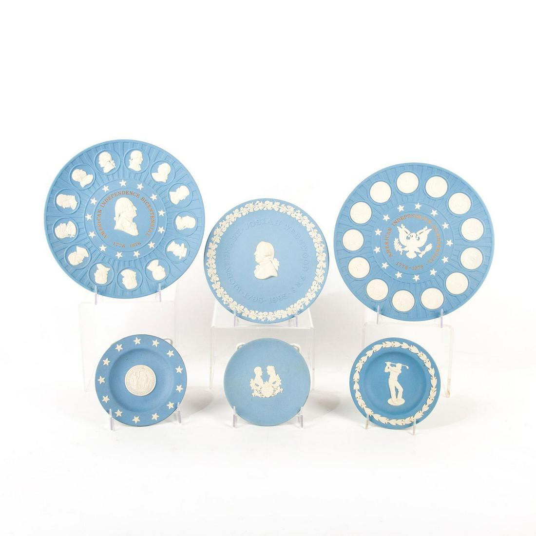 6pc Wedgwood Jasperware Plate Set: Light blue ground plates with designs in white relief. 3 sm plates, 1m plate, and 2 larger decorated plates. Wedgwood backstamp. Sm plates 4.5"D. M bicentenary plate 6.75"D. L bicentennial plate8.25"D