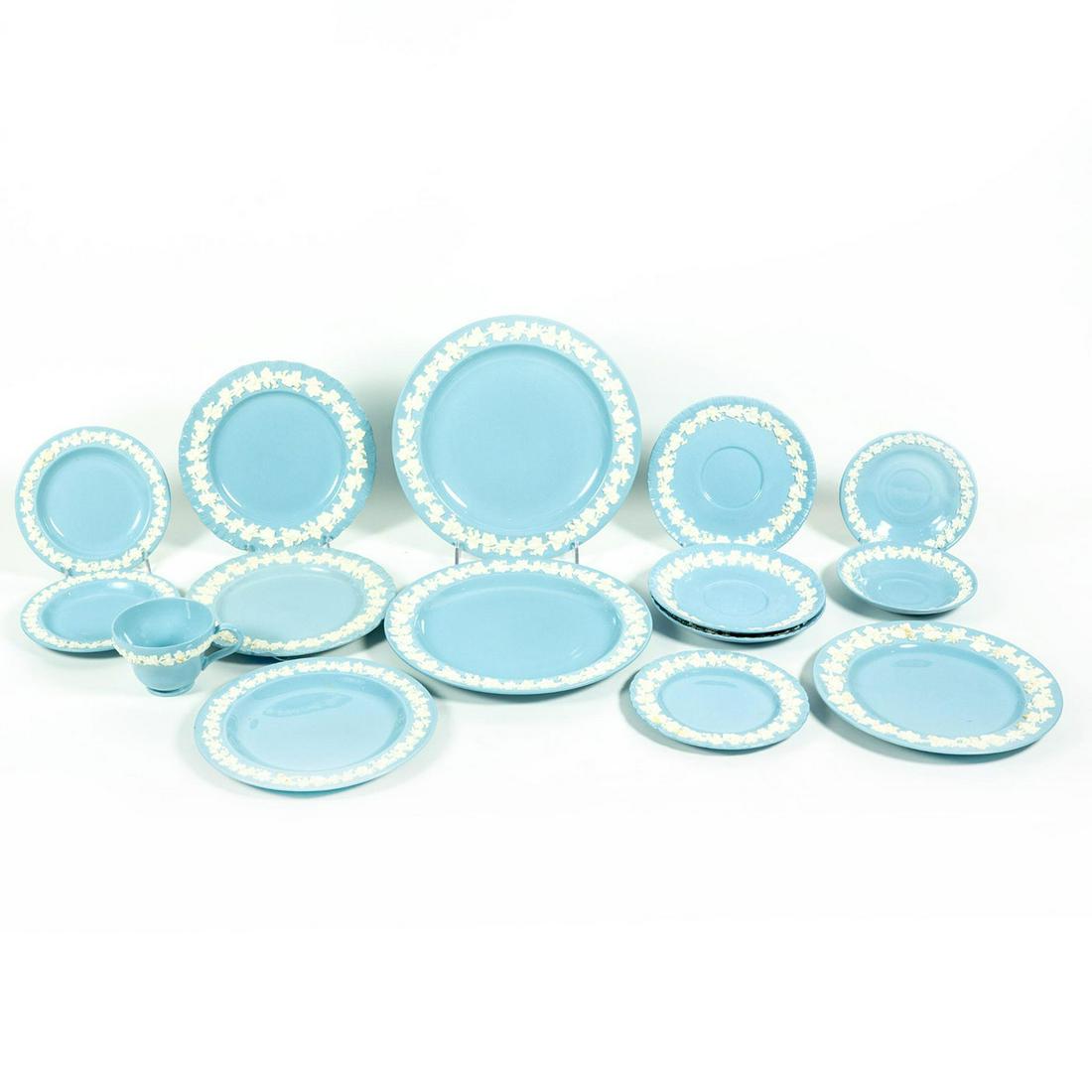 15pc Wedgwood Embossed Queensware Tea Cup and Plates: 1 tea cup, 2 saucers, 3 dessert plates, 3 salad plates, 4 M plates, and 2 dinner plates. Wedgwood backstamp. Tea cup 2.5"H. Saucer 2.5"D. Dessert plate 6"D. Salad plates 7"D. M plates 8.25"D. Issued: