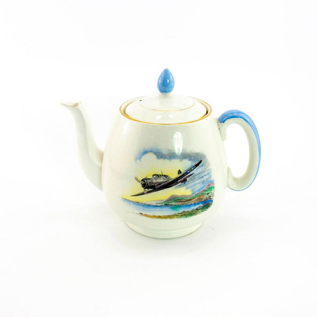 Shelley Tea Pot, R.A.F. Fighter Plane: Vintage tea pot with World War II fighter plane image in blue and yellow, gilded rim. Unit of the R.A.F. 696/A. stamped on the bottom. Crazing due to age. Shelley backstamp. Issued: 20th c. Dimensions