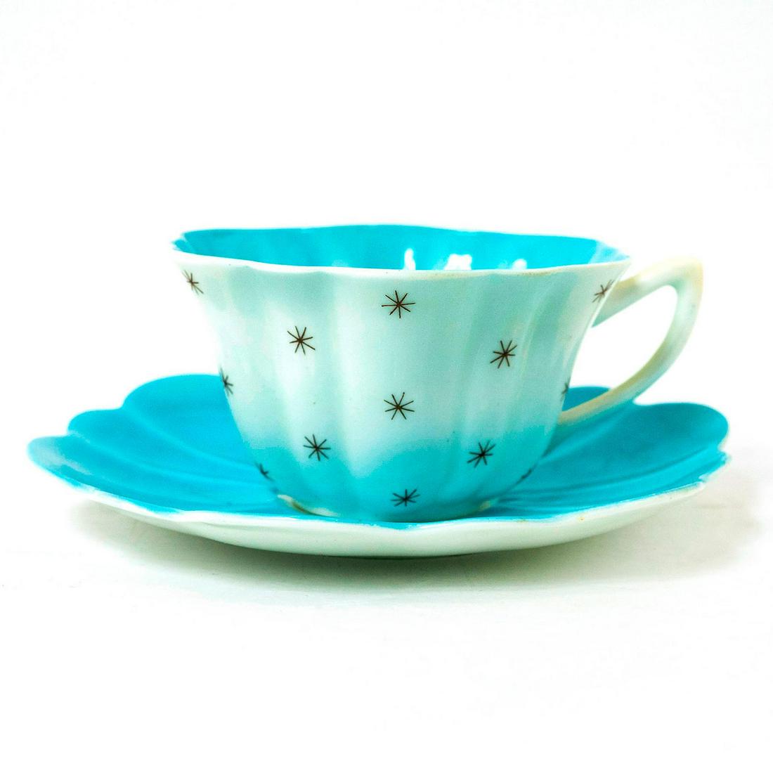 Shelley Fine Bone China Cup And Saucer, Pole Star, Blue: Pole Star, pattern 13774. White glazed finished with blue interior. Shelley backstamp. Marked Pole Star on the underside. Issued: 20th c. Dimensions: 5.5"W x 3"H Manufacturer: Shelley China Country of