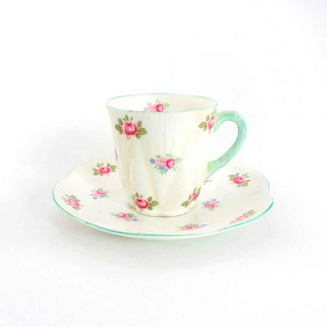 Shelley Fine Bone China Dainty Demi Cup And Saucer,: Rosebud pattern. Glazed bone china demitasse cup and saucer, with pink and blue flora; green trim. Shelley backstamp. Issued: 20th c. Dimensions: 2.25"H x 4.75" dia. Manufacturer: Shelley China Countr