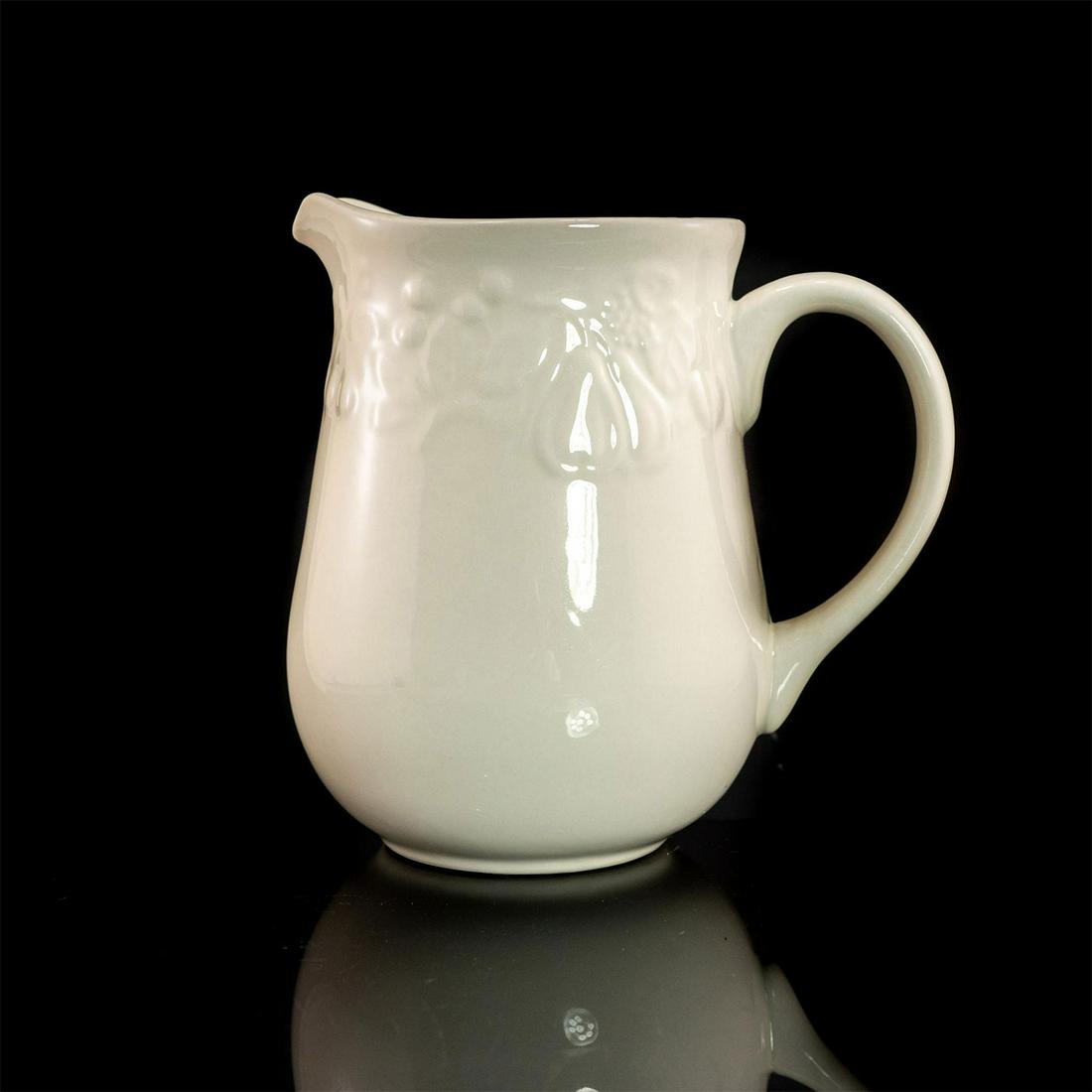 Gibson Embossed Water Pitcher: Beautiful, white pitcher with grape vine design. Gibson backstamp. Issued: 19th c. Dimensions: 8"H Manufacturer: Gibson Country of Origin: China