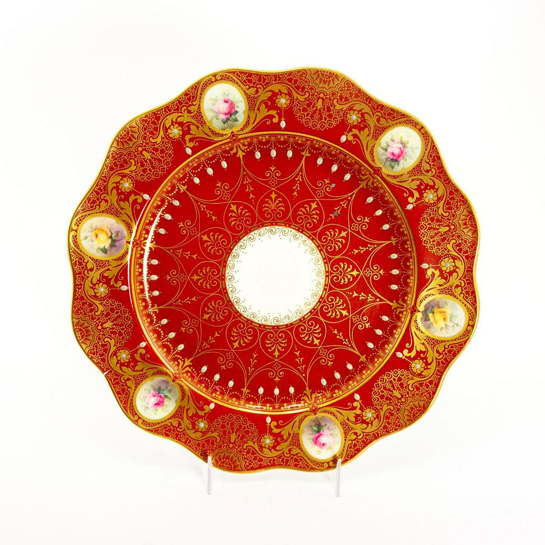 Royal Worcester Red Gold Floral Serving Tray: Beautiful gold decorative patterning. Floral portraits around rim. Royal Worcester backstamp. Minor chip to edge of plate. Issued: 19th c. Dimensions: 10" dia. Manufacturer: Royal Worcester Country of