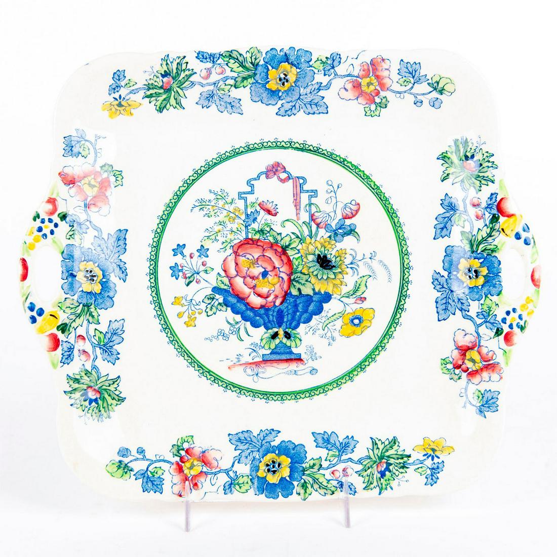 Masons Ironstone China Strathmore Tray: Square form cake platter with Masons Strathmore floral pattern. The handles feature raised flowers in green, blue and yellow. Mason's backstamp. Age related crazing to body. Issued: 20th c. Dimensions