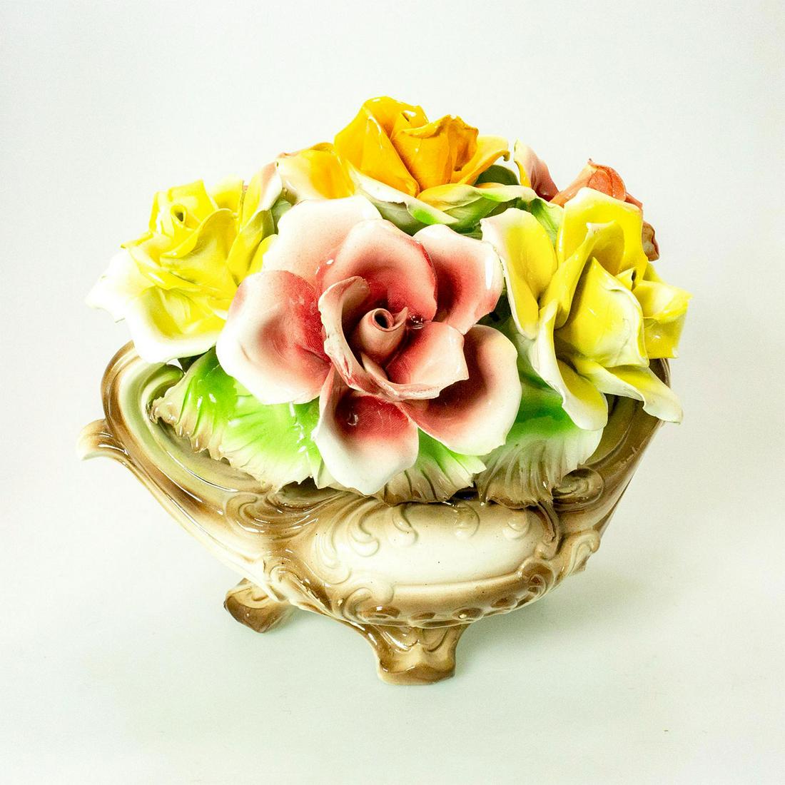 Capodimonte Porcelain Centerpiece Bowl, Pink and Yellow: Glazed; Beautiful, open flowers and leaves. Stunning dish vessel. Capodimonte backstamp. Issued: 19th c. Dimensions: 9"L x 14"W Manufacturer: Capodimonte Country of Origin: Italy