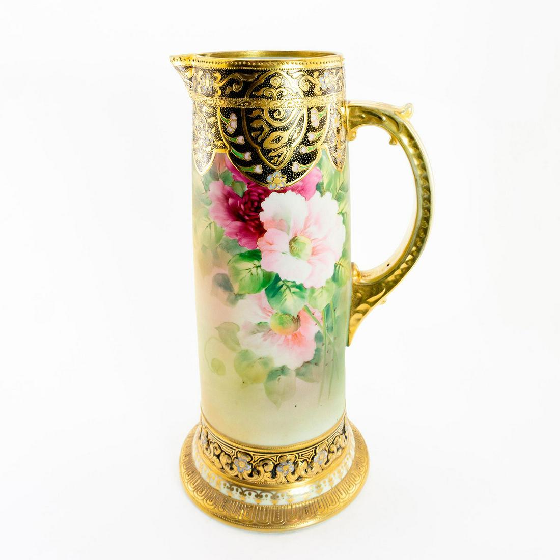 Large Vintage Nippon Moriage Floral Pitcher: Japanese porcelain pitcher; hand painted lush flowers encircling body enclosed by gilt beaded and floral design. Exquisite piece with intricate floral detailing; gilded rim, base and handle. Nippon ba