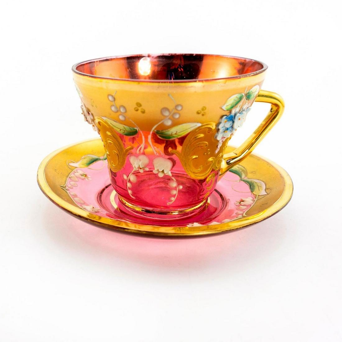 Venetian Chrystal Tea Cup And Saucer: Hand decorated pink and gold 2 piece glass tea set with relief flower design. Issued: 20th c. Dimensions: 3"H