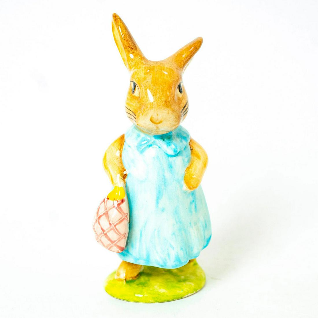 Mrs. Flopsy Bunny - Beswick - Beatrix Potter Figurine: Beswick Backstamp. Light blue dress, pink bag. Artist: Arthur Gredington Issued: 1968 - 1998 Dimensions: 4''H Manufacturer: Beswick Country of Origin: England