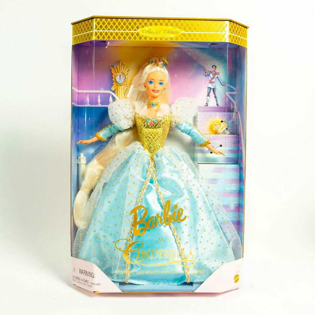 Barbie as Cinderella Doll: Barbie dressed in elegant blue, gold and mesh dress. Long, flowing blonde hair. With Original Box. SKU #16900 Issued: 1996 Dimensions: 12"H Manufacturer: Mattel Country of Origin: Malaysia
