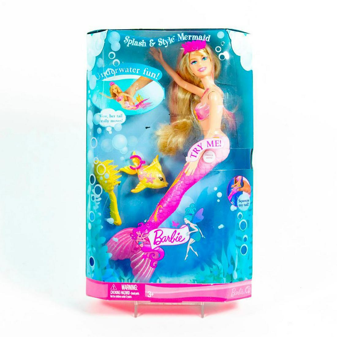 Barbie Doll, Splash and Style Mermaid: Mermaid Barbie has a pink fin and tail. Includes brush and fish. SKU #M9310 #M9311. #barbie #mermaids Issued: 21st c. Dimensions: 12"H Manufacturer: Mattel Country of Origin: Indonesia