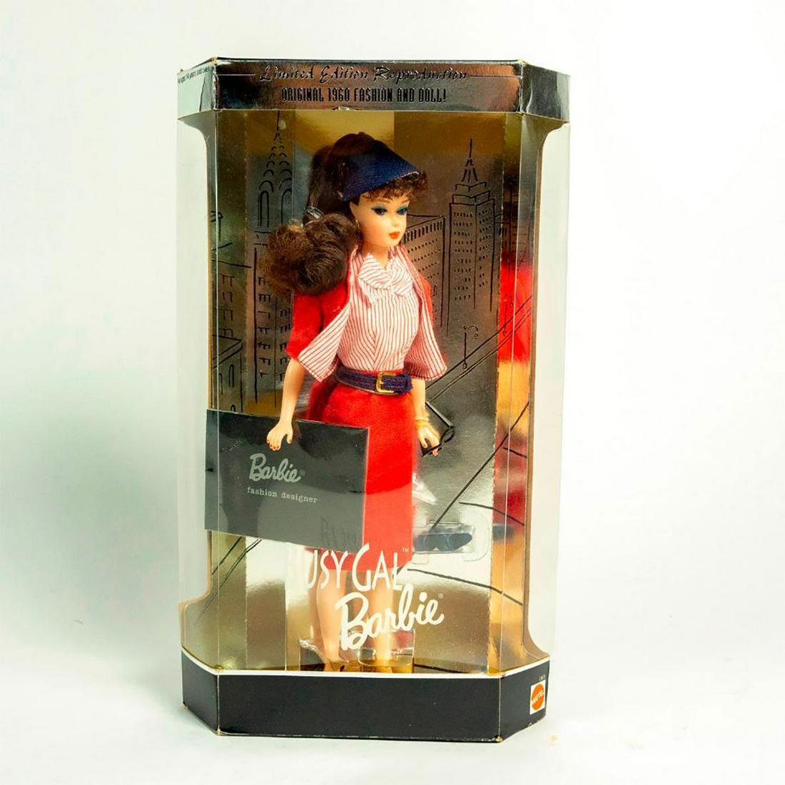 Busy Gal Barbie Doll: Barbie dressed in all designer; red and white, holding black glasses. With Original Box. SKU #13675 Issued: 1995 Dimensions: 11"H Manufacturer: Mattel Country of Origin: China