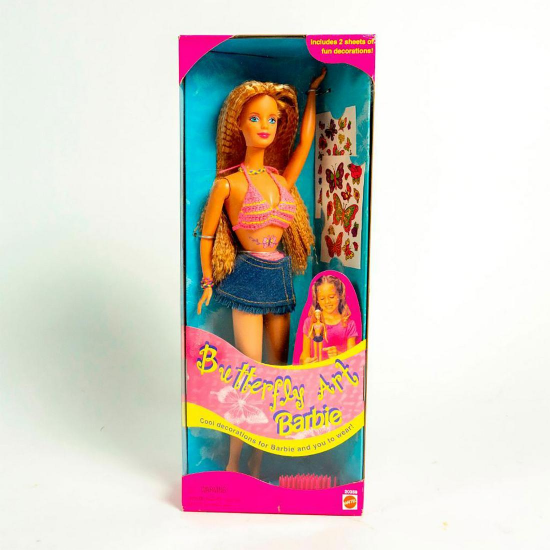 Butterfly Art Barbie Doll: Barbie dressed in pink and yellow bikini. Tattoo art included. With original box. SKU #20359. Issued: 1998 Dimensions: 11"H Manufacturer: Mattel Country of Origin: China