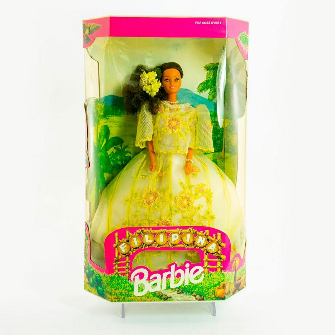 Mattel Barbie Doll, Filipina: She wears a yellow gown with detailed beaded embroidery, a pearlized necklace and flowers in her hair. SKU #9903. Issued: 1993 Dimensions: 12"H Manufacturer: Mattel Country of Origin: Philippines