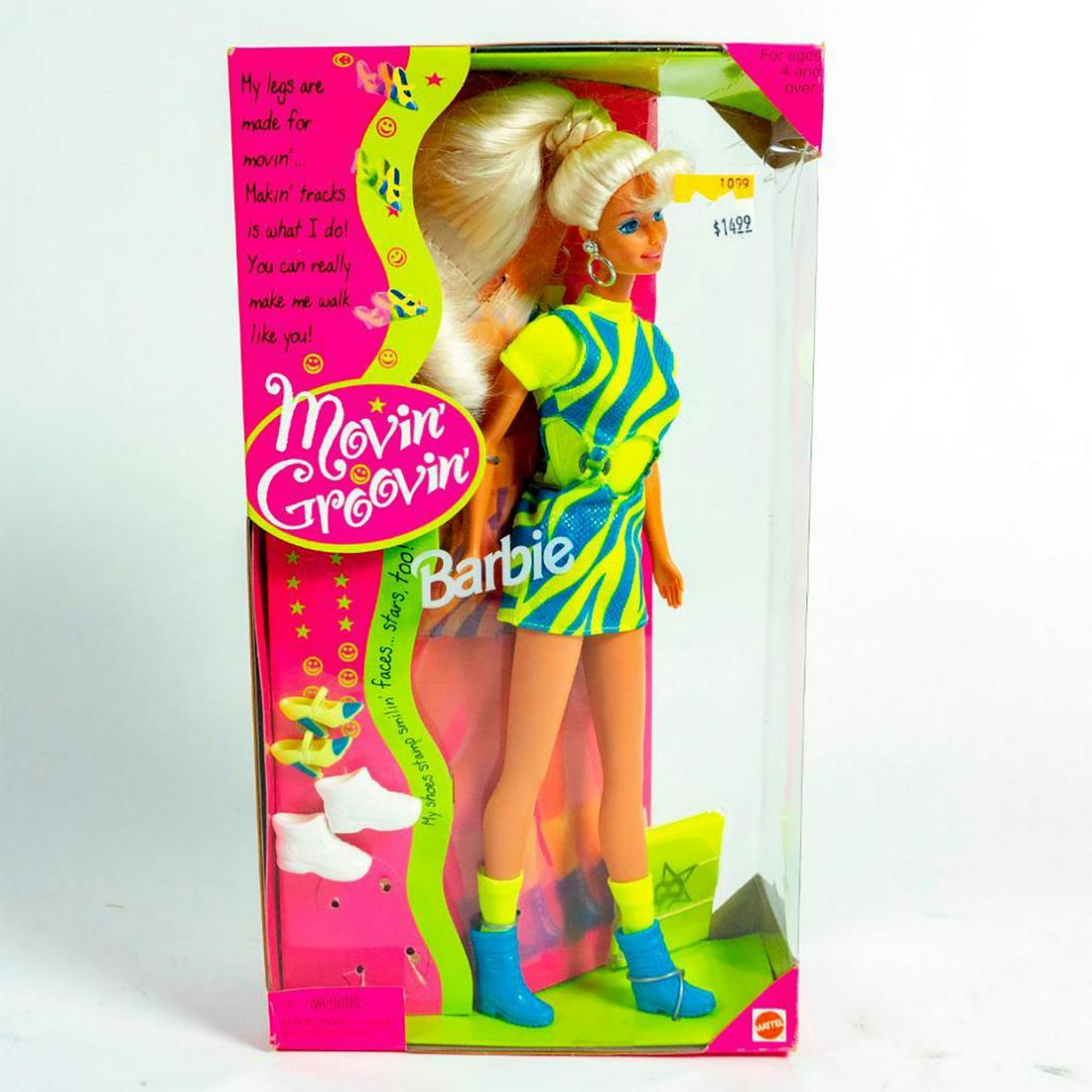 Mattel Barbie Doll, Movin' Groovin': Walking Barbie. Includes stamping tennis shoes, walking boots and stamping shoes. 11.5"H Barbie wearing a bright green and blue outfit. Includes original box. SKU #17714. Issued: 1990s Dimensions: 12.
