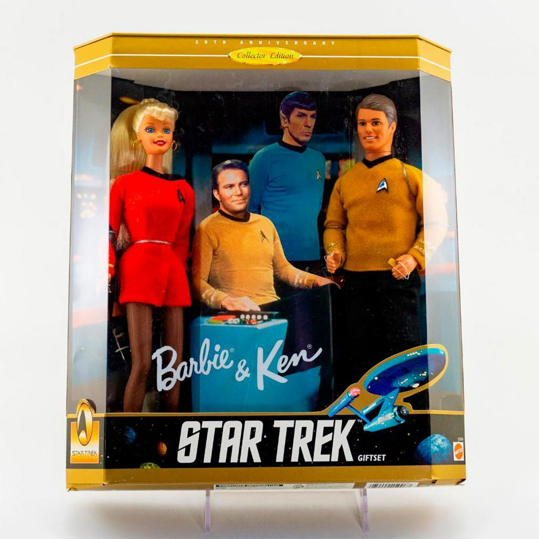 Mattel, Barbie & Ken Star Trek Giftset: Barbie and Ken in Star Trek; Red dress on Barbie and burnt orange vest on Ken. With original box. SKU #15006. Issued: 1996 Dimensions: 12"L x 14"H Manufacturer: Mattel Country of Origin: Indonesia
