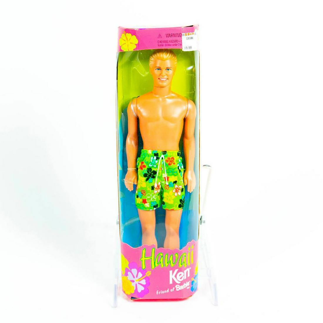 Mattel, Hawaii Ken; Friend of Barbie Doll: Ken doll in green swimming trunks with colorful, floral prints. With original box. SKU #24616. Issued: 1999 Dimensions: 13"H Manufacturer: Mattel Country of Origin: Indonesia