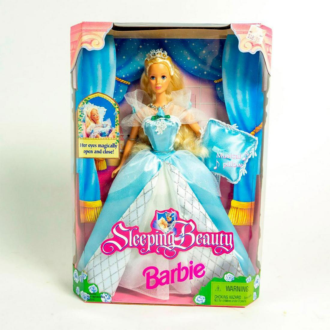 Sleeping Beauty Barbie Doll: Barbie dressed in a beautiful, blue and white dress; tiara and necklace. Musical pillow included. With original box. SKU #20489. Issued: 1998 Dimensions: 11"H Manufacturer: Mattel Country of Origin: C
