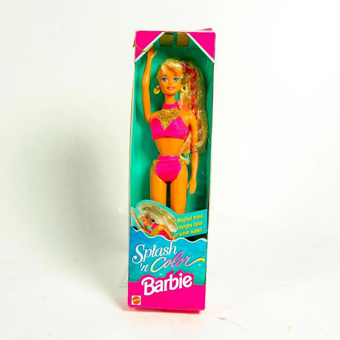 Splash and Color Barbie Doll: Barbie in a pink bikini with gold accents, gold earrings. Orange braid in blonde hair. With Original Box. SKU #16169 Issued: 1996 Dimensions: 11"H Manufacturer: Mattel Country of Origin: China