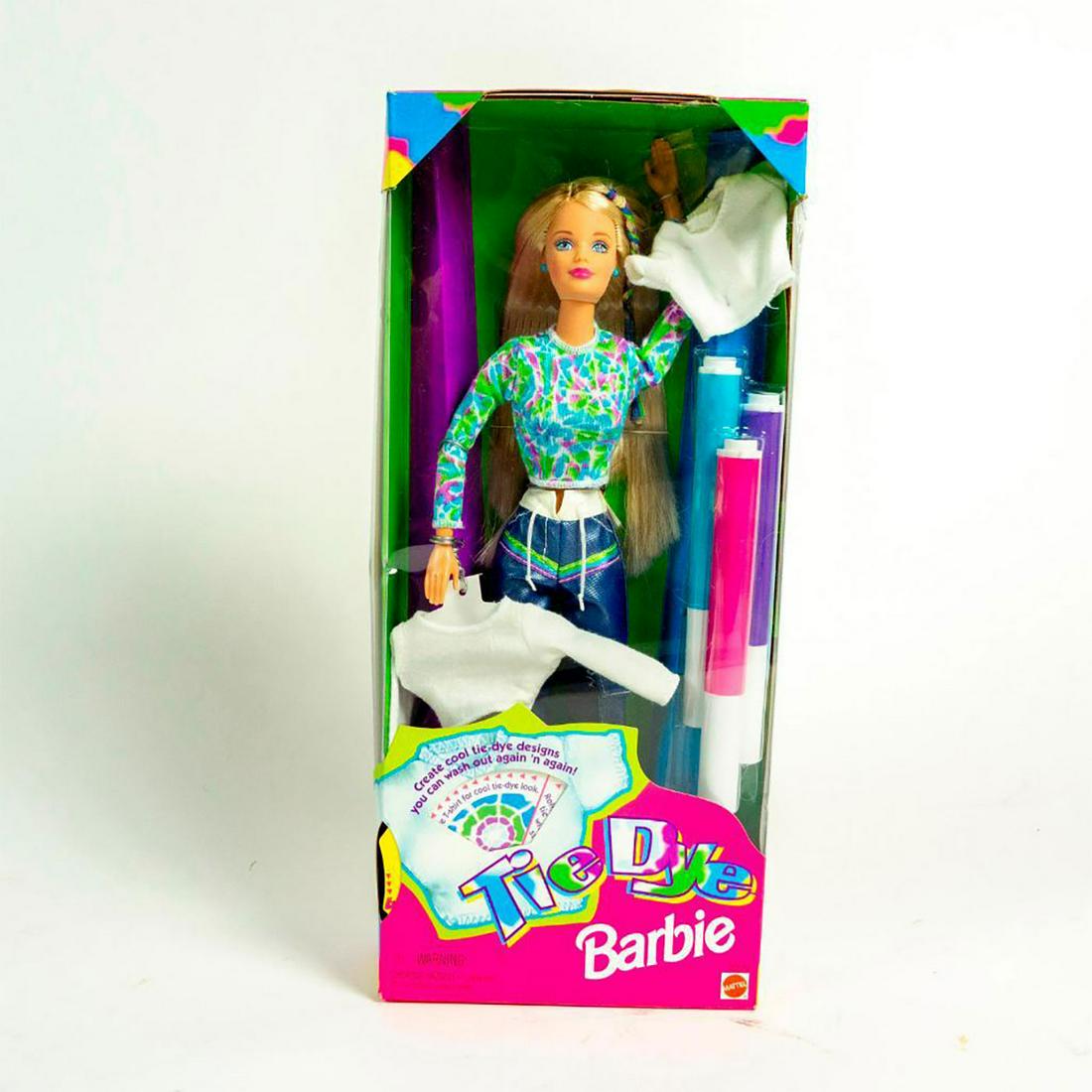 Tie Dye Barbie Doll: Barbie in tie dye gear; blank T-shirts included with markers. With original box. #tiedyebarbie SKU #20504 Issued: 1998 Dimensions: 12"H Manufacturer: Mattel Country of Origin: China