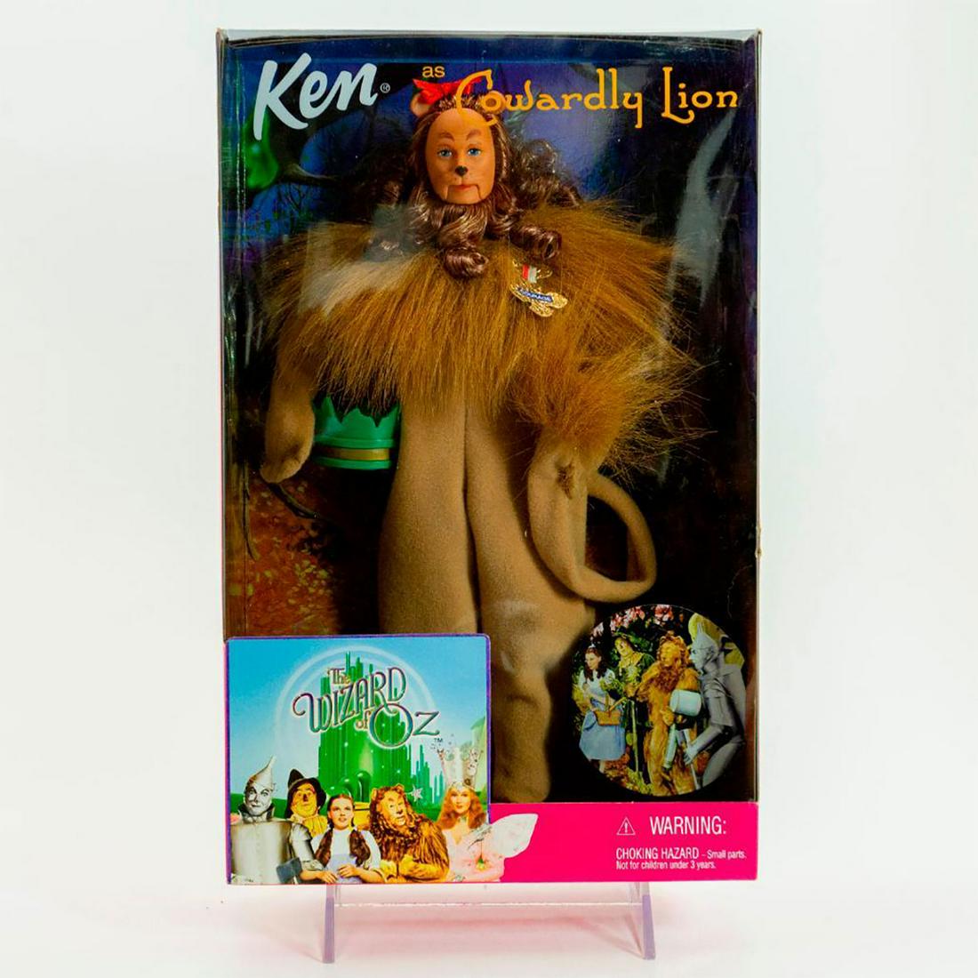 Ken Doll as Cowardly Lion from The Wizard of Oz: Ken doll is whimsical in a plush lion suit, green crown and the wonderful badge of courage. With original box. SKU #25814 #26384. Issued: 2007 Dimensions: 12"H Manufacturer: Mattel Country of Origin: 