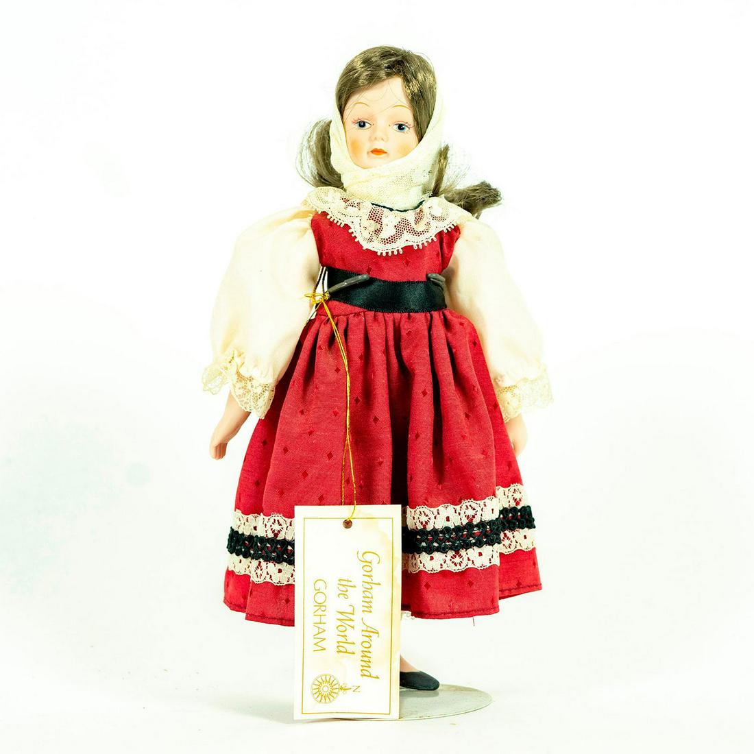 Vintage Doll, Gorham, Sweet Marini: Collectible doll in red and white dress with white veil wrapped tightly around the head. Original label attached to back. Original tag under dress. Attached to stand. Dimensions: 11"H Manufacturer: Go