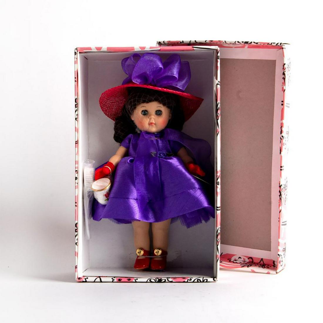 Vogue Doll Company Ginny Doll, Taking Tea: The Vogue Ginny Collection. Limited edition of 1000. 8" Ginny doll wearing a purple dress. Includes hair brush and tea cup. Complete with Certificate of Authenticity. Housed in original box. Issued: 2