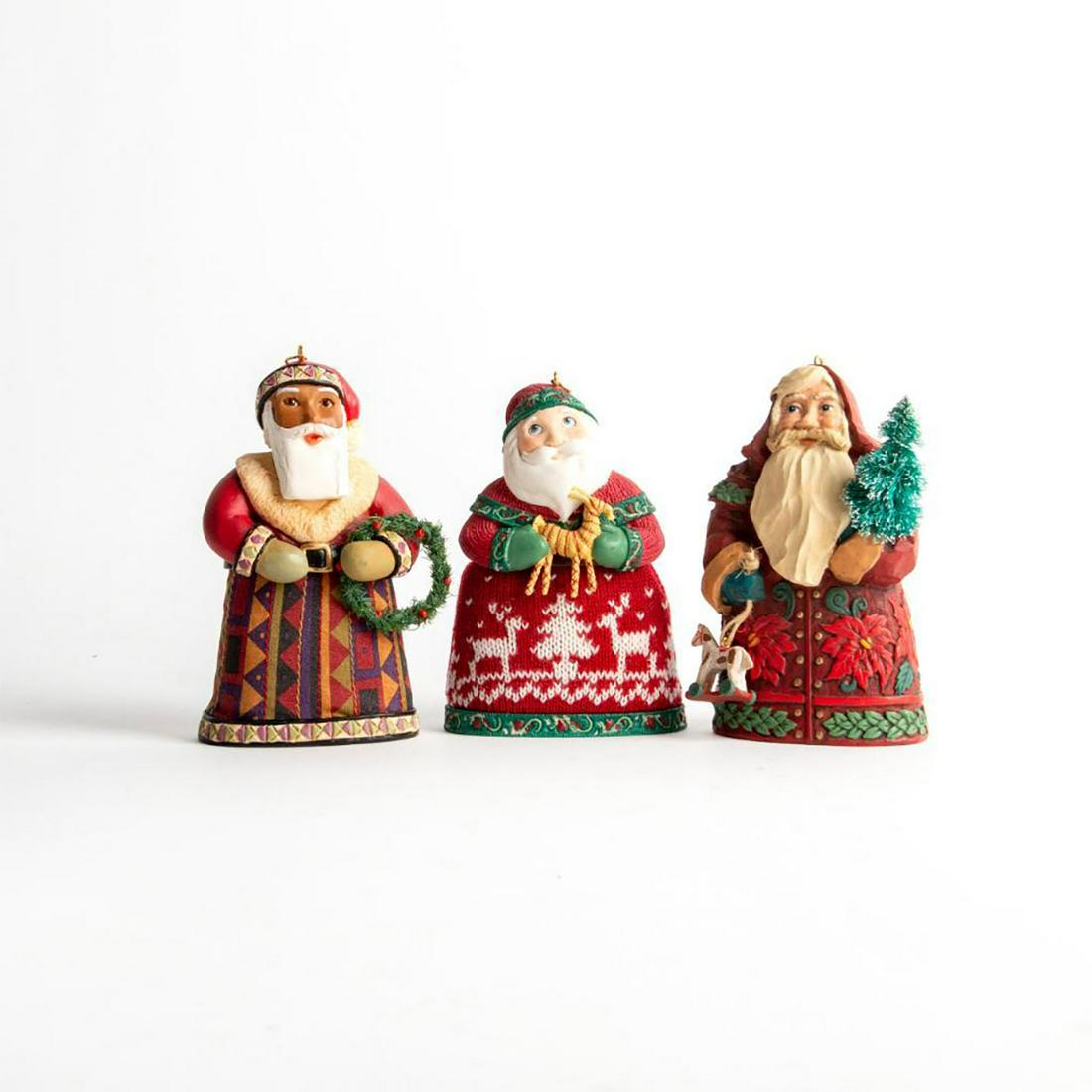 3 Ornament Figurines, Santas From Around The World: Decorative Santa Claus of The United States of America, Norway and Germany. Hallmark mark to bottom base along with country. Artist: Edythe Kegrize, LaDene Votruba, Don Palmiter, Linda Sickman Issued: