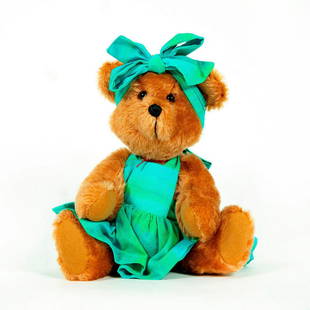 Whatabear Teddy Bear, PJ: Teddy bear in green dress and bow. Glass eyes, wool felt pads. Artist: Robert Welch, Allen Chau Issued: 20th Century Dimensions: 11"L Manufacturer: Whatabear Country of Origin: USA