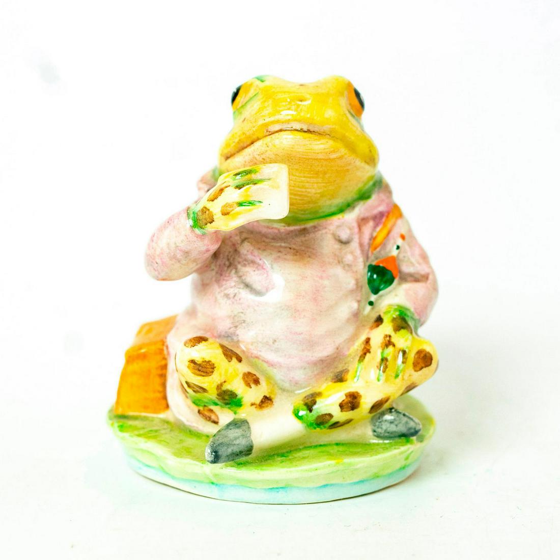 Mr. Jeremy Fisher Spotted Legs - Beswick - Beatrix: First Version with Spotted Legs. Beswick Backstamp. Lilac coat, green frog with small brown spots on head and legs. Artist: Arthur Gredington Issued: 1950 -c.1974 Dimensions: 3''H Manufacturer: Beswic